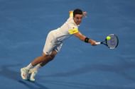 Roberto Bautista Agut retrieves a ball