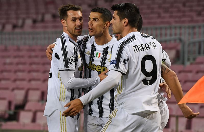 Cristiano Ronaldo celebrating a goal with Aaron Ramsey