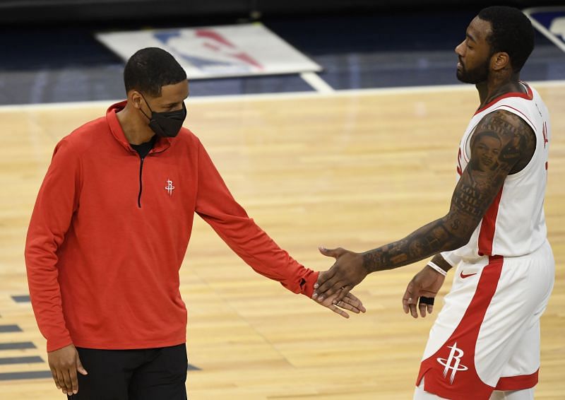 Head coach Stephen Silas of the Houston Rockets congratulates John Wall #1 during a game