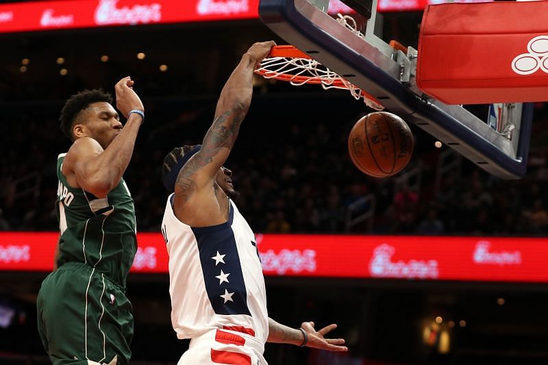 Bradley Beal #3 of the Washington Wizards dunks in front of Giannis Antetokounmpo #34 of the Milwaukee Bucks in 2020.