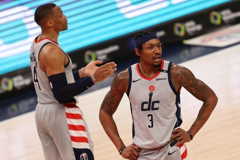 Bradley Beal #3 and Russell Westbrook #4 look on. (Photo by Patrick Smith/Getty Images)