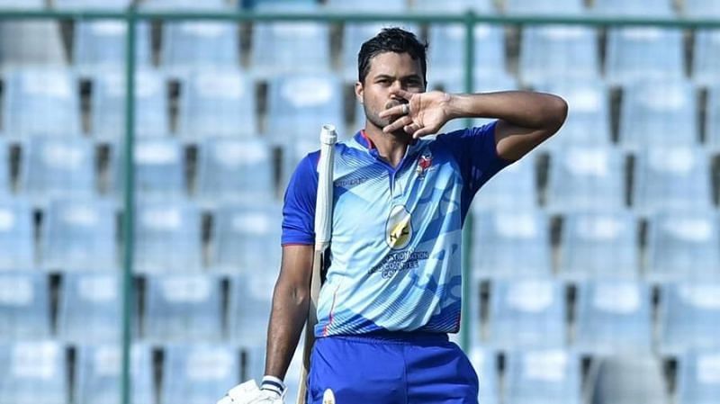 Aditya Tare celebrates after his hundred in the 2021 Vijay Hazare Trophy final.