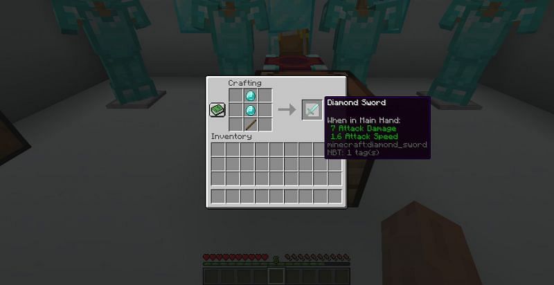 Minecraft gamers can craft a diamond sword by placing two diamonds and one stick in a single column of a crafting bench (Image via Minecraft)