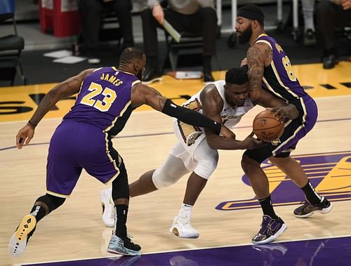 Zion Williamson #1 is fouled by LeBron James #23 (Photo by Harry How/Getty Images)