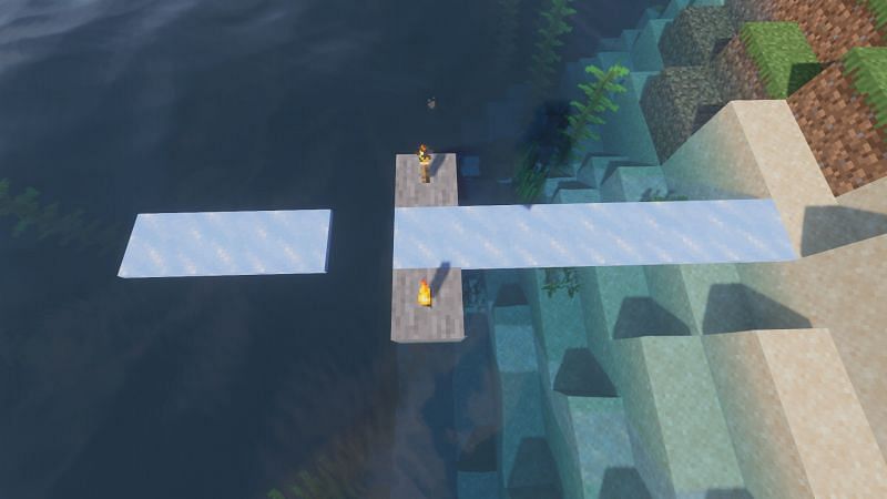  Torches melting an Ice block due to light level (Image via Minecraft)
