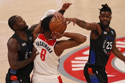 Rui Hachimura #8 is defended by Julius Randle #30 and Reggie Bullock #25 (Photo by Patrick Smith/Getty Images) (Photo by Patrick Smith/Getty Images)