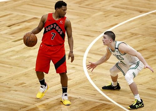 Payton Pritchard (#11) of the Boston Celtics defends against Kyle Lowry (#7) of the Toronto Raptors