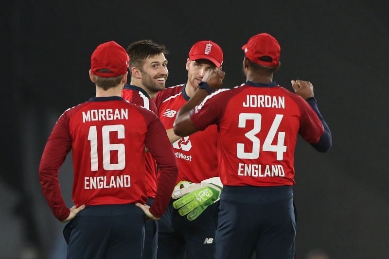 Mark Wood and Jos Buttler celebrate with England teammates. Pic: BCCI