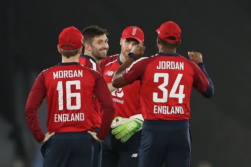 Mark Wood and Jos Buttler celebrate with England teammates. Pic: BCCI