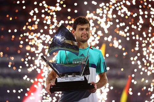 Aslan Karatsev poses with the Dubai Tennis Championships trophy