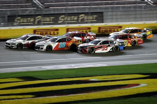 <a href='https://www.sportskeeda.com/player/christopher-bell' target='_blank' rel='noopener noreferrer'>Christopher Bell</a> (95), Alex Bowman (88) and Ryan Newman lead a pack at Las Vegas Motor Speedway in NASCAR Cup Series South Point 400 last year. Photo/Getty Images