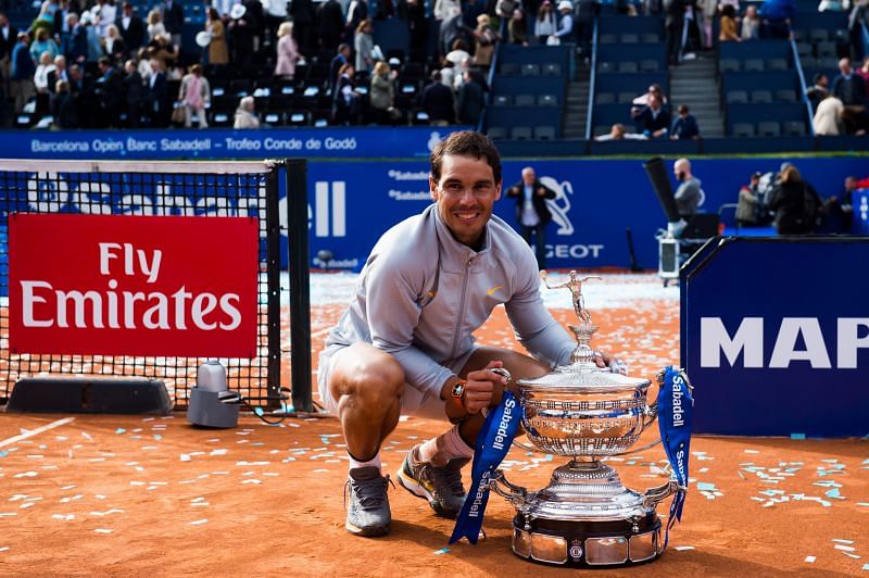 Rafael Nadal poses with the winner&#039;s trophy at the Barcelona Open in 2018