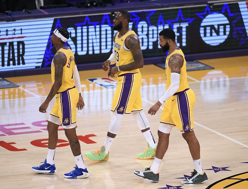 LeBron James and Markieff Morris of the Los Angeles Lakers react as they leave the court after a timeout trailing the Phoenix Suns during a 114-104 Suns win at Staples Center on March 02, 2021, in Los Angeles, California. (Photo by Harry How/Getty Images)