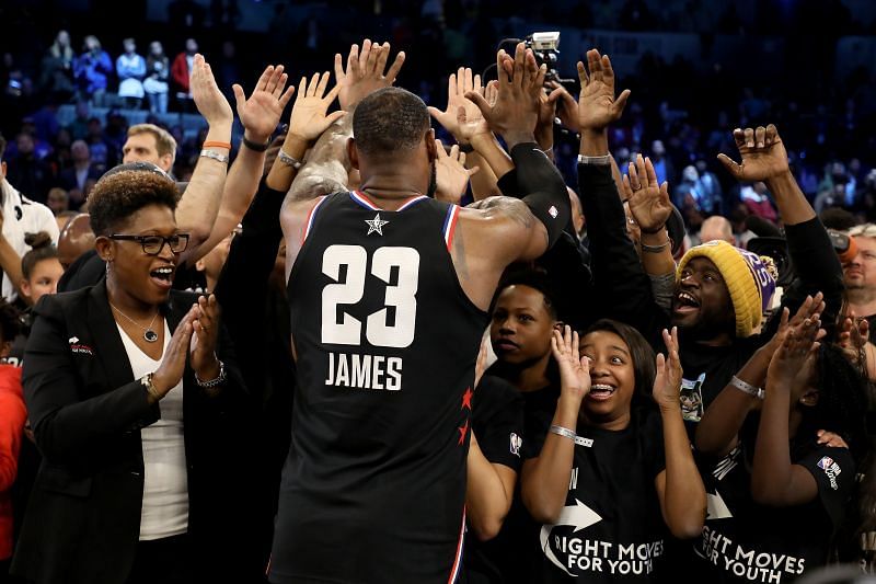 LeBron James (#23) of the LA Lakers and Team LeBron celebrates with representatives of the Right Moves for Youth Charlotte charity after their 178-164 win over Team Giannis during the 2019 NBA All-Star