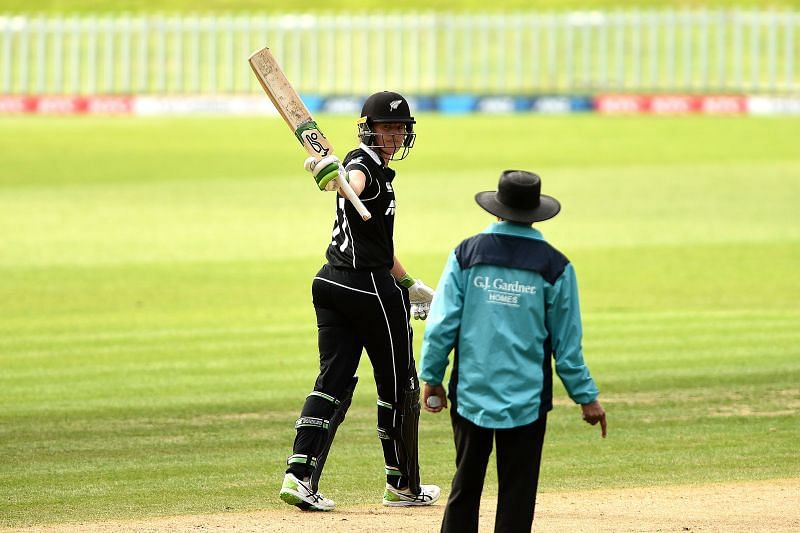 Amy Satterthwaite celebrates her century against England.