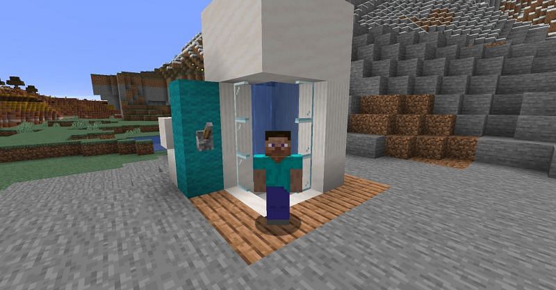 Steve standing in front of his shower in Minecraft. (Image via Minecraft)