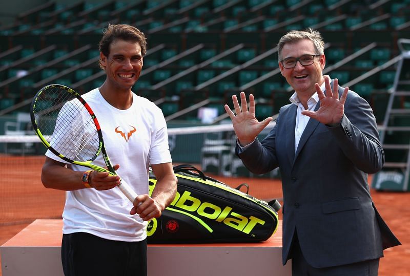 Rafael Nadal of Spain poses with his racket manufacturer Babolat at the 2017 French Open in Paris, France