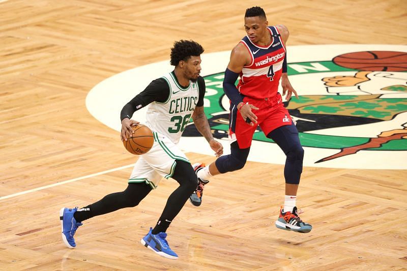 Marcus Smart #36 of the Boston Celtics drives against Russell Westbrook #4 of the Washington Wizards at TD Garden. (Photo by Maddie Meyer/Getty Images).