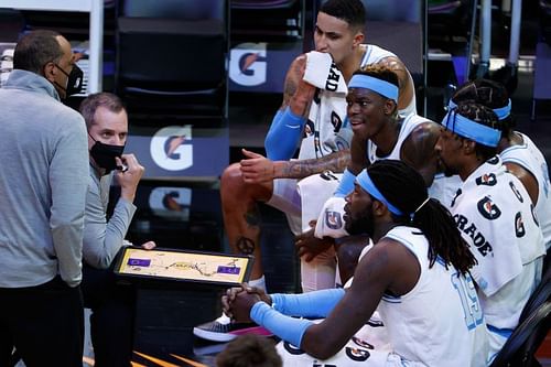 Head coach Frank Vogel talks with Kyle Kuzma #0, Dennis Schroder #17 and Montrezl Harrell #15. (Photo by Christian Petersen/Getty Images)