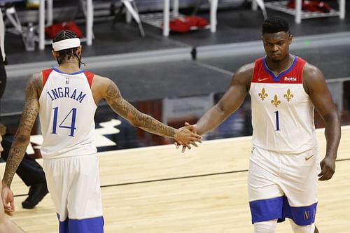 Brandon Ingram #14 and Zion Williamson #1 high five against the Miami Heat. (Photo by Michael Reaves/Getty Images)