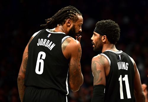 Kyrie Irving (#11) and DeAndre Jordan (#6) of the Brooklyn Nets