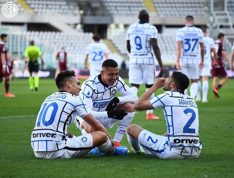 Inter Milan defeated Torino 2-1 to move nine points clear at the top of the Serie A.