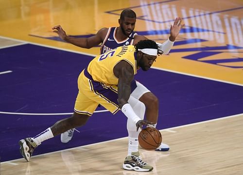 Montrezl Harrell #15 loses the ball as he is guarded by Chris Paul #3. (Photo by Harry How/Getty Images)