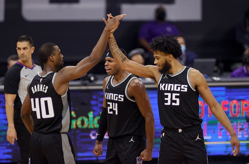 Harrison Barnes #40 of the Sacramento Kings is congratulated by Buddy Hield #24 and Marvin Bagley III #35. (Photo by Ezra Shaw/Getty Images)