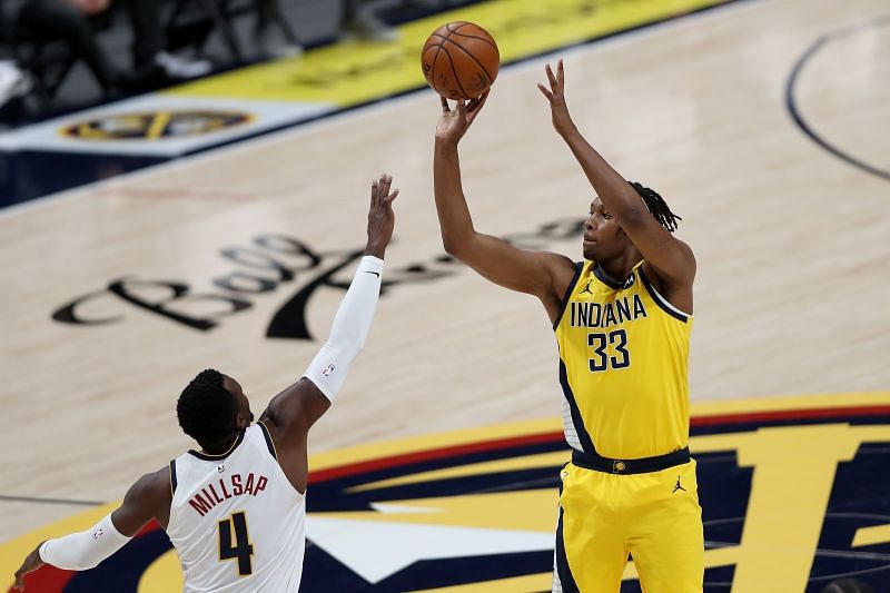 Myles Turner shoots over Paul Millsap 