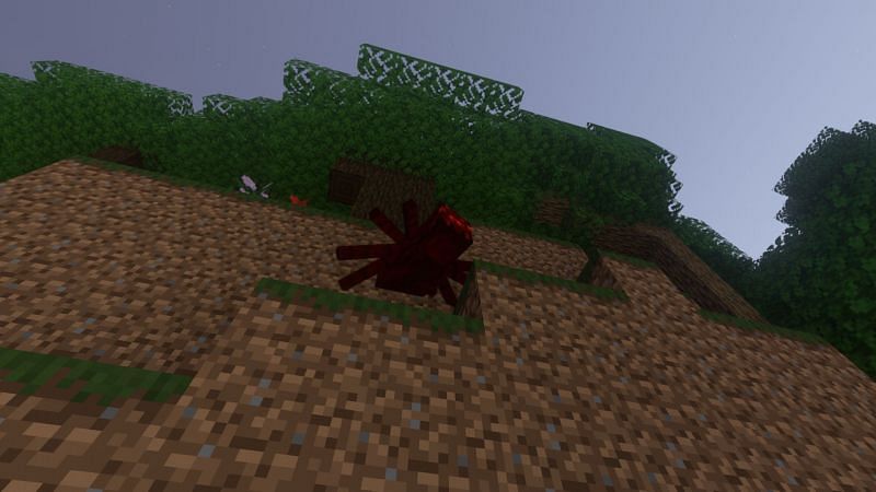 Shown: A spider that has climbed up a high wall (Image via Minecraft)
