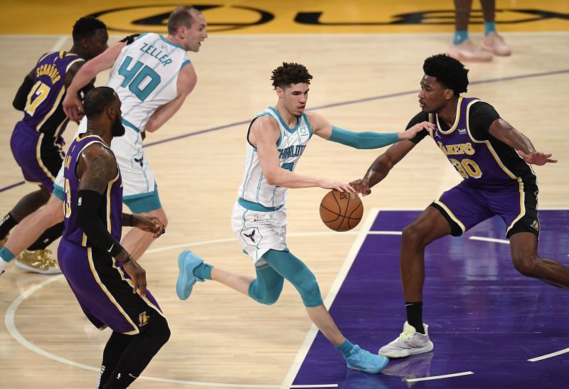 LaMelo Ball #2 dribbles in front of Damian Jones #30. (Photo by Harry How/Getty Images)