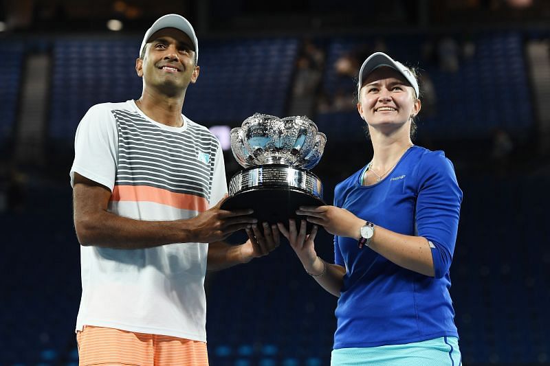Rajeev Ram (left) and Barbora Krejcikova with the 2021 Australian Open mixed doubles trophy
