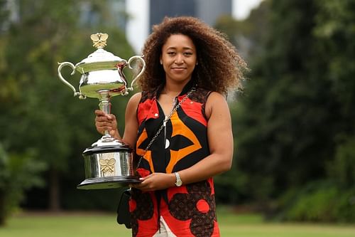 Naomi Osaka poses with the 2021 Australian Open trophy