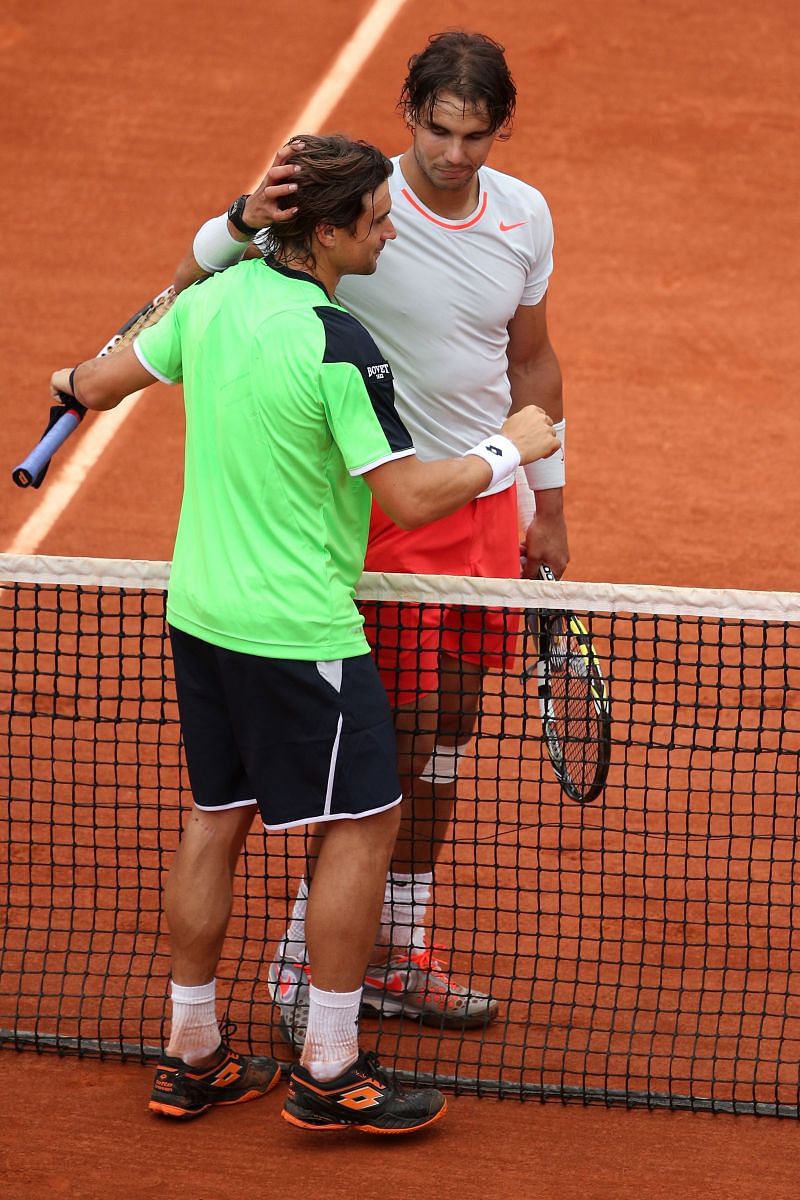 David Ferrer and Rafael Nadal embrace at the net during their 2013 French Open clash