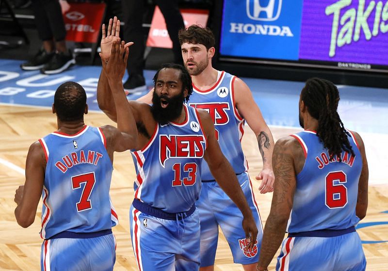 Kevin Durant (#7), James Harden (#13), Joe Harris (#12) and DeAndre Jordan (#6) of the Brooklyn Nets