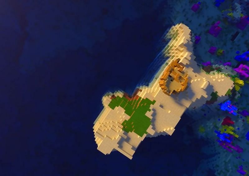 A shipwreck on a small island with a coral reef nearby in Minecraft (Image via Minecraft &amp; Chill/YouTube)