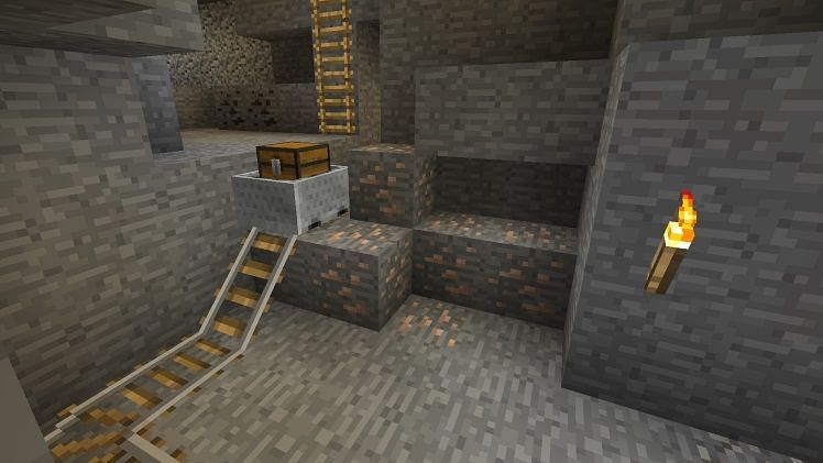 Minecraft rail and iron ore (Image via Minecraft)