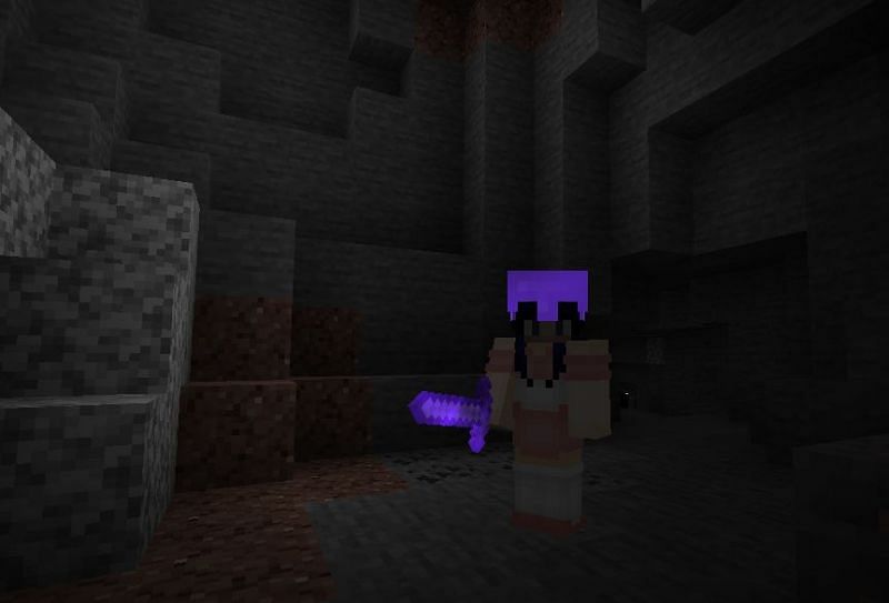 Player Wearing a Helmet and Holding a Sword Enchanted with Mending; Image via Minecraft