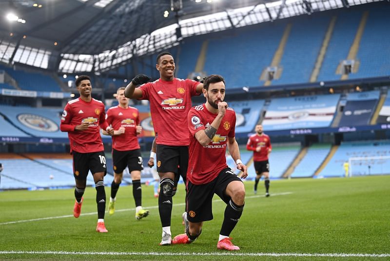 Bruno Fernandes celebrates scoring the first goal from a penalty against Manchester City.