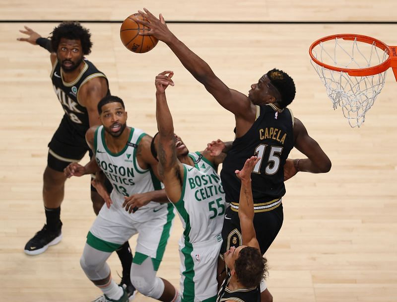 Clint Capela #15 of the Atlanta Hawks blocks a shot by Jeff Teague #55 of the Boston Celtics 