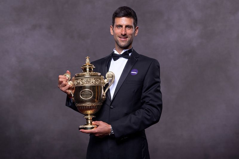 Novak Djokovic with his 2019 Wimbledon title.