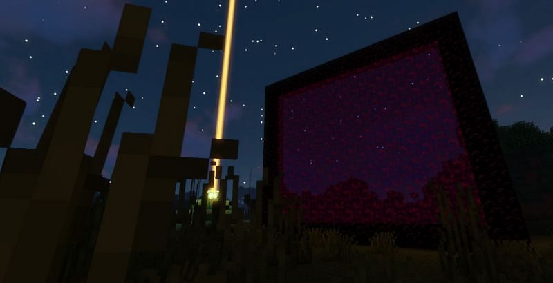 A massive Nether Portal next to a Beacon (Image via Minecraft)