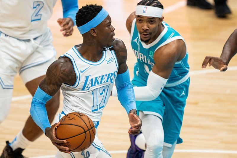 Dennis Schroder #17 drives to the basket while guarded by Devonte' Graham #4.