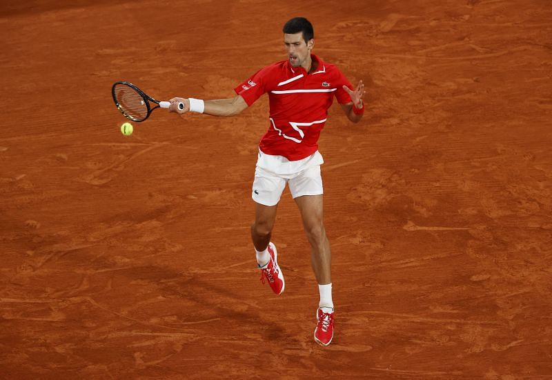 Novak Djokovic hits a forehand at Roland Garros last year