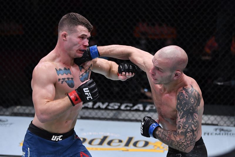 Sasha Palatnikov (R) lands a damaging blow on Louis Cosce at UFC 255