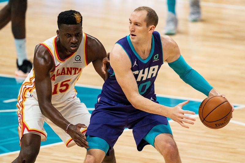 Clint Capela (#15) of the Atlanta Hawks guarding Cody Zeller