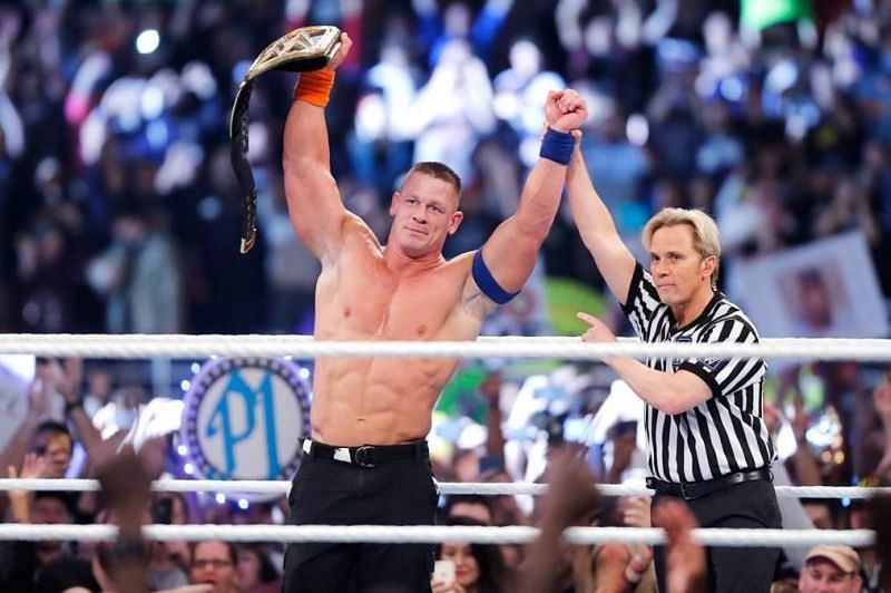 John Cena is one world title away from breaking the record.