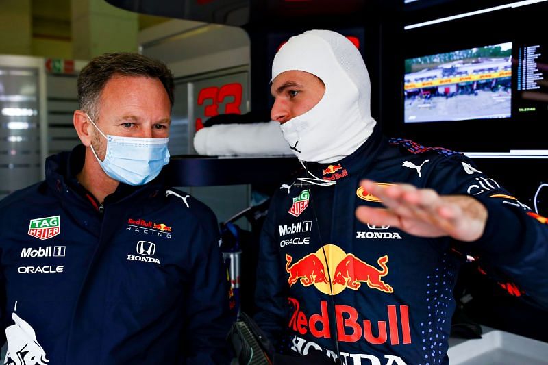 Max Verstappen of Red Bull Racing and Team Principal Christian Horner chat in the garage during 2021 Imola GP practice. (Photo by Mark Thompson/Getty Images)