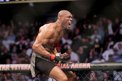 Kamaru Usman celebrates his win at UFC 261