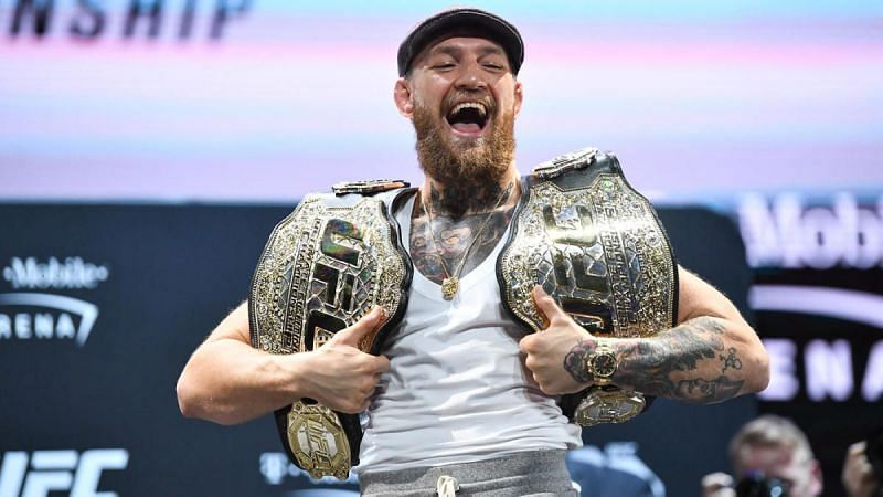 Conor McGregor with the UFC lightweight and featherweight titles